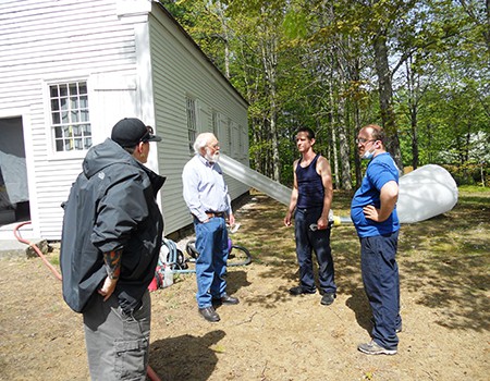 Bill Confers with Octagon Workers